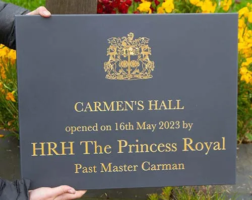 Corian can be used for intricate logos and small text Slate Corian Opening Plaque