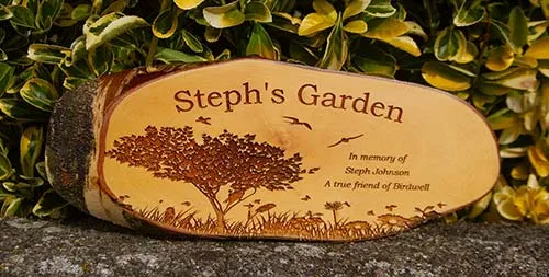 A rustic timber slice with the bark still on. Rustic Wooden Memorial