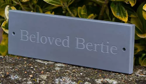 The wording on this pet memorial was left unpainted. Slate Pet Memorial