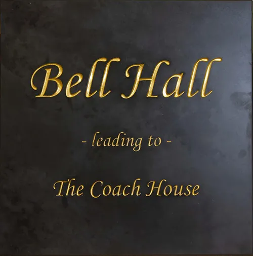 Slate house sign with gold text