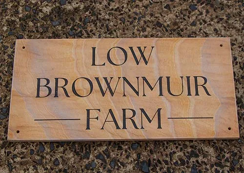 Unusul stone makes for an interesting farm sign. Sandstone Farm Sign