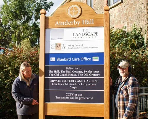 This large business with sliding panels is ideal for an estate. Large Business Sign
