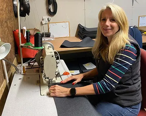 Annie is a seamstress in the wheel cover workshop Annie Damm