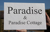 Slate sign painted white with raised slate letters. Slate sign painted white with raised slate letters.