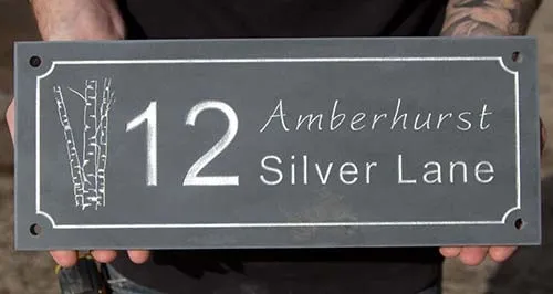 Slate sign with indented line border and interesting image. Slate Address Sign