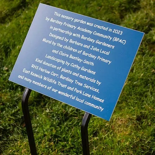 Double wrought ion tree stake with large plate Engraved Plaque on Blue acrylic Laminate