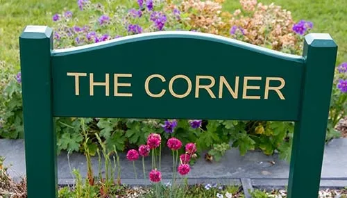 Painted House Sign on Posts