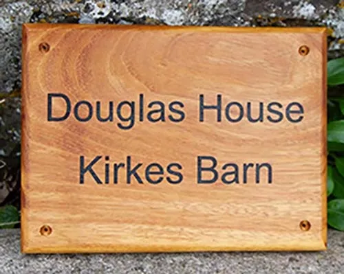 Wooden house sign made from durable Iroko wood. Wooden House Sign