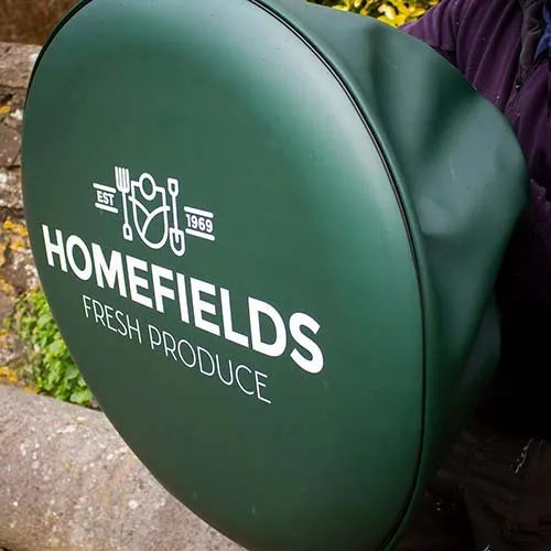 Full wrap wheel cover with green skirt. Full Wrap Wheel Cover