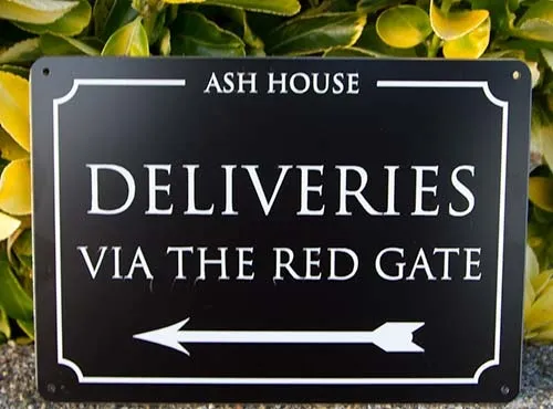 Black aluminium composite with white cut vinyl text Black Deliveries Sign