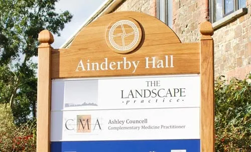 Combination of aluminium panels and Oak. Industrial Estate Signage