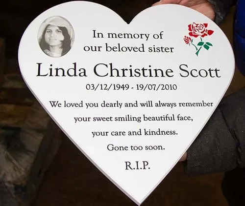 This corian heart memorial has a photo inset. Corian Heart Memorial