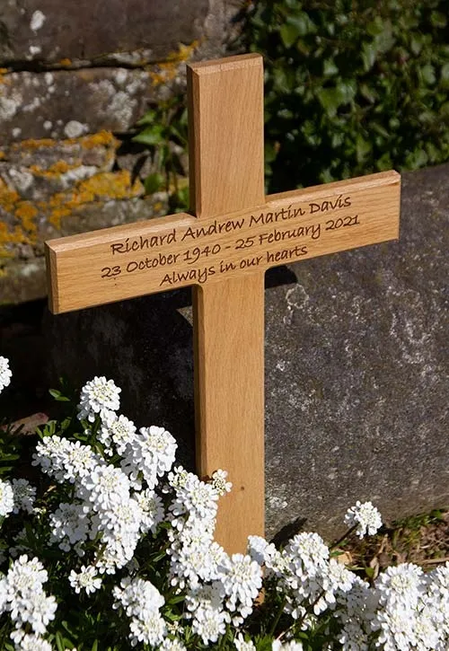 The lettering has been laser engraved into the oak. Oak Memorial Cross