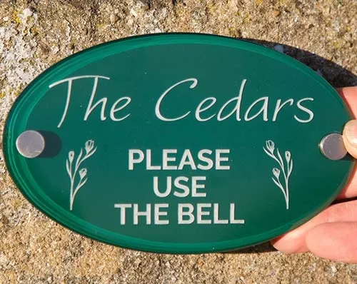 The design has been etched into the paint on the reverse of the sign. Painted & Etched House Sign